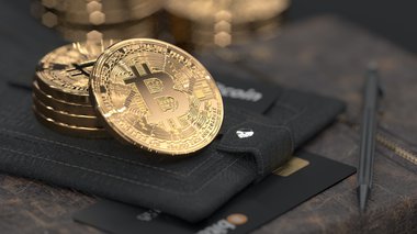 monete bitcoin sopra un portafoglio